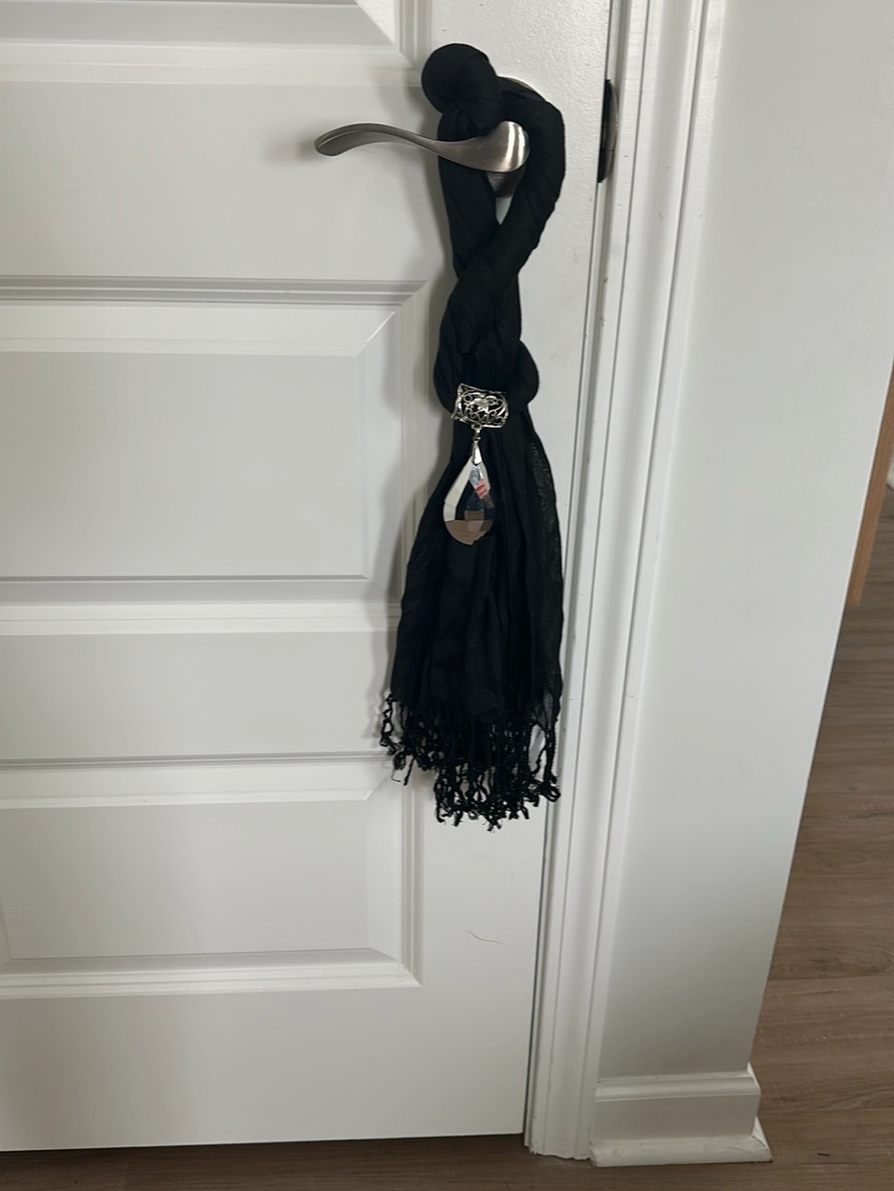 Elegant Black Braided Scarf with Silver Pendant Accent